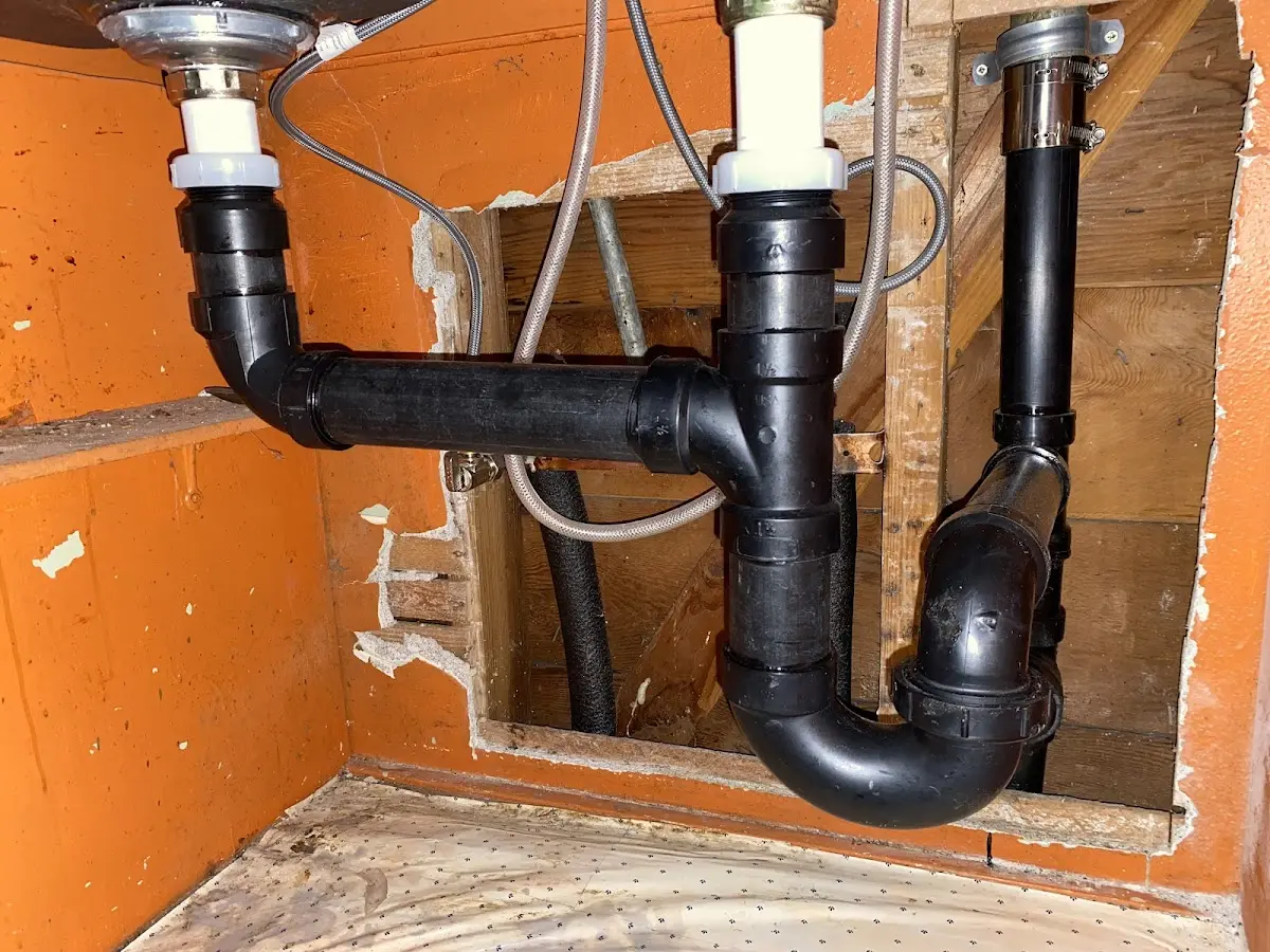 Professional Garbage Disposal Repair equipment and tools on the job in Gardner